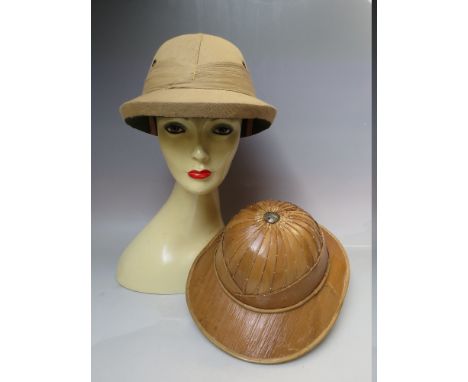 A VINTAGE INDIAN PITH HELMET, together with a similar style sun hat and a selection of ladies vintage hats (9)Condition Repor