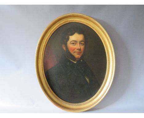 (XIX). An oval portrait study of a gentleman wearing a black coat and sporting large sideburns, unsigned, oil on canvas laid 