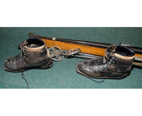 Pair of vintage circa 1970 skies with poles and boots 