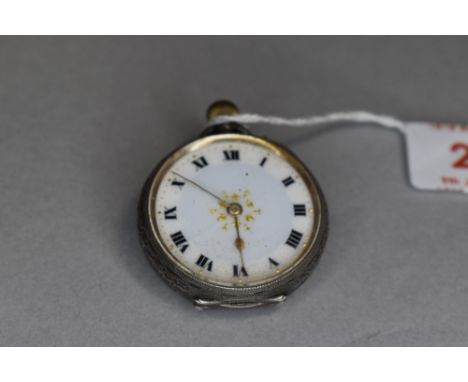 A small HM silver top wound pocket watch having Roman numeral dial with gilt minute dots and central decoration to white enam