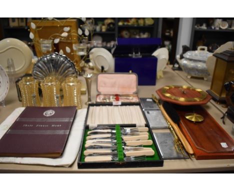 A selection of hardware including cutlery light shades and cigarette cases
