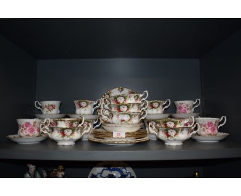 A selection of tea cups saucers and soup cups by Royal Albert in a various designs