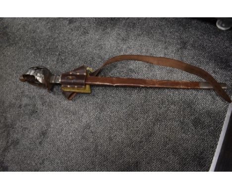 A replica cutlas sword and scabbard