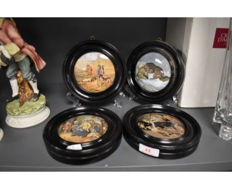 Four antique ceramic paste pot lids in ebonised frames