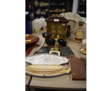 A selection of items including Staiger clock and sausage dog figure
