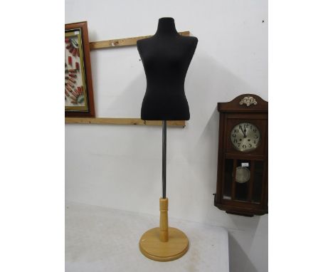 A mannequin body on stand