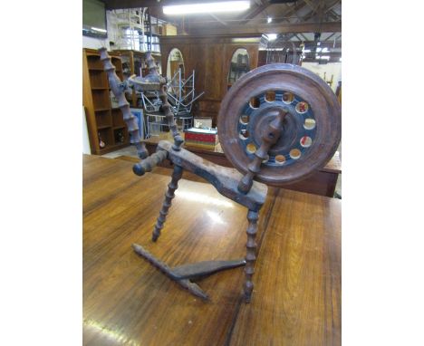vintage wooden spinning wheel with bobbin legs