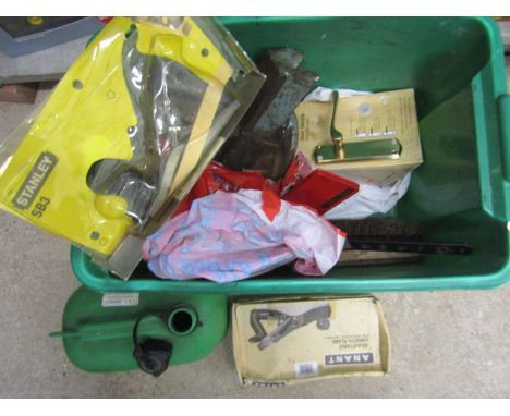 A box of various tools and door furniture plus a petrol can