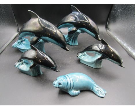4 Poole pottery dolphins and a seal