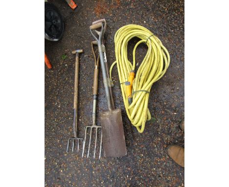 Garden tools and a hose