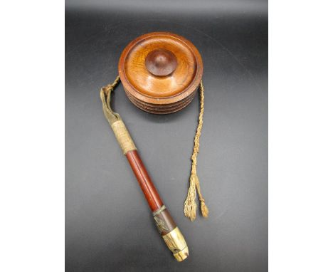 A hunting whistle/whip with wooden turned holder
