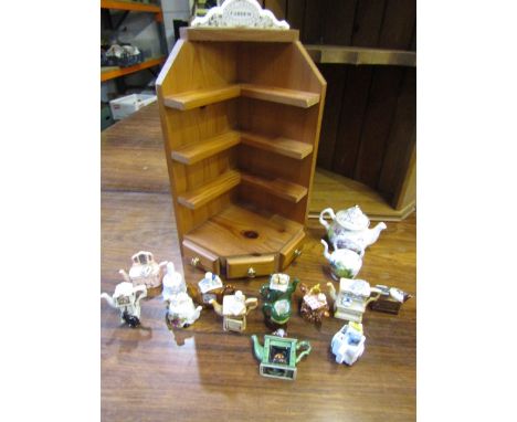 Mini teapots with a display stand pus another pine display shelf