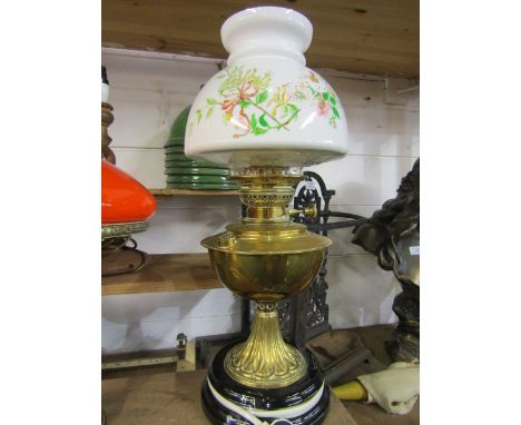 Converted brass oil lamp with white glass floral shade