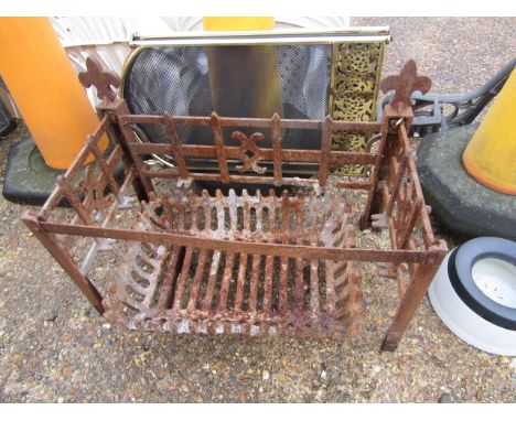 A metal fire grate and surround along with fire guard&nbsp;