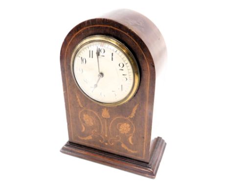 An Edwardian walnut mantel clock, the domed top with a white enamel numeric dial, with boxwood tulip inlay, on rectangular fo