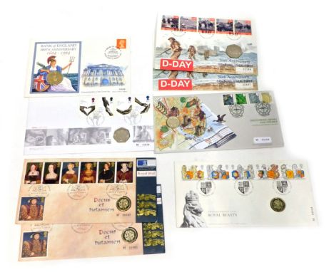 A group of first day covers and coin packs, comprising The Philatelic Numismatic Royal Beast one pound coin, Henry VIII and W