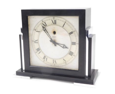 A Smith electric art deco mantel clock, in black and stainless steel case, on a white ground with silver dial, 16.5cm high, 1