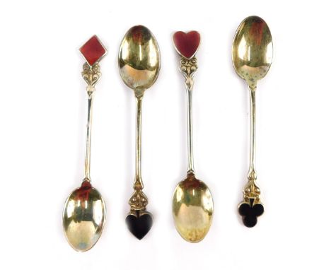 A cased set of four George V silver novelty teaspoons, each top decorated in enamel with a playing card suit, Birmingham 1924