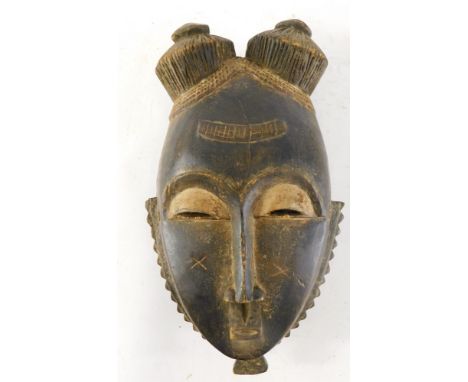 An Old Mblo portrait mask with encrusted patina, Cote D'Ivoire, 33cm high. 