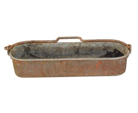 A galvanized oblong planter, with shaped oval ends, and swing handle, 13cm high, 61cm wide. 