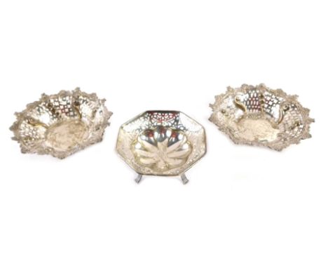 Two Victorian silver bonbon dishes, each with a pierced and flared rim, with scroll and rose decoration, Chester 1875, and an