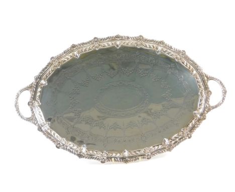 A Barraclough &amp; Sons of Leeds Victorian silver galleried serving tray, with shell reeded handles, and engine engraved bri