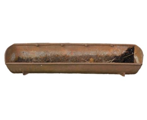 A metal feeding trough, on four bracket feet, 41cm high, 146cm wide, and 39cm deep. 