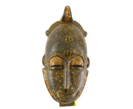 A Baule Mblo spiritual portrait mask, Cote D'Ivoire, 33cm high. 