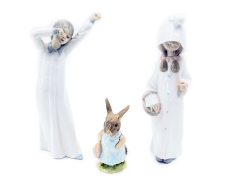 Three ceramic figures, comprising a Lladro figure of a girl carrying basket, 21cm high, a Nao figure of a child sleeping, 19c
