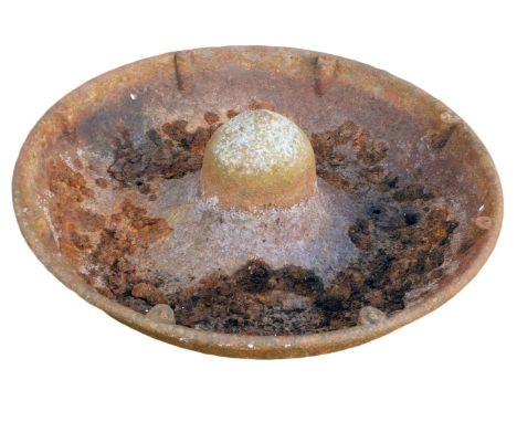 A metal Mexican hat feeding trough, 74cm diameter. 