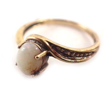 A 9ct gold dress ring, the oval opal in four claw setting, with twist design shoulders, bead effect, ring size M, 1.8g all in