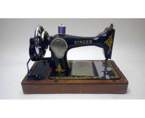 A Vintage boxed table top Singer sewing machine, model 15K80, with instruction manual.