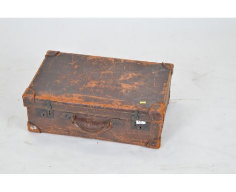 Vintage cowhide suitcase.