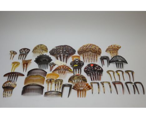 A collection of vintage simulated tortoiseshell hair combs of varying sizes, some embellished with zircon and filigree metalw