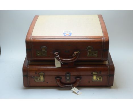 Two vintage leather-bound suitcases by 'Victor' Luggage, England; together with three picture frames, gilt painted and ebonis