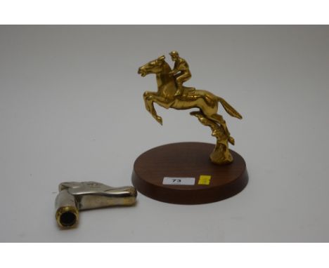 A brass horse racing themed car mascot mounted on wooden plinth; together with a silver-on-brass horse head with screw thread