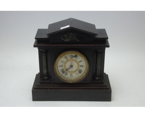 A Seikosha Tokyo Japan ebonised mantel clock with roman dial.