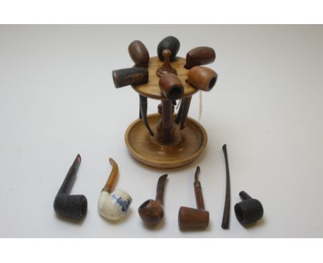 Eleven vintage tobacco pipes, to include: a blue and white ceramic bowl marked 'Holland', with simulated amber mouthpiece; Dr