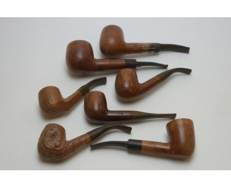 Seven vintage tobacco pipes, to include: a Ben Wade large pipe; three similar stamped 'Reject'; a Parker Super Bruyere; and t