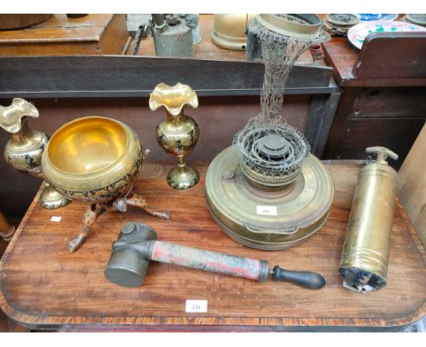 Selection of antique brass ware includes oil lamp , brass fire extinguisher etc . 