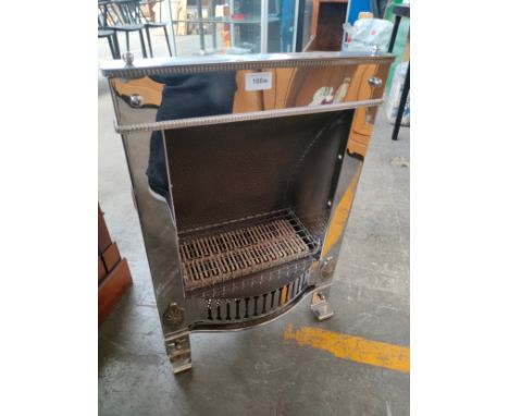 Art deco themed electric fire in chrome finish . 