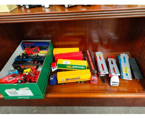 Shelf of lorry playworn vehicles etc . 