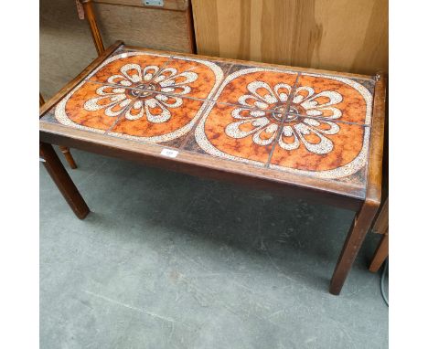 Mid century teak coffee table with tile inserts. 