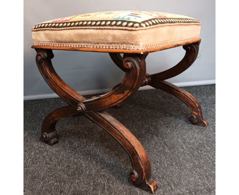 Regency style stool, the tapestry straw filled seat above a central turned stretcher and X-frame with carved scroll detail [4