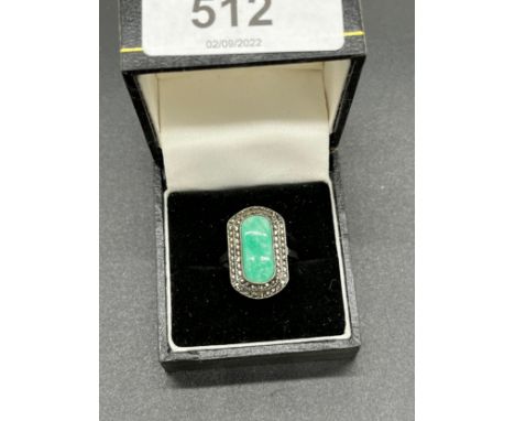 935 silver art deco ring set with a Jade centre stone off set by marcasite cluster. [Ring size N] [Will post] 