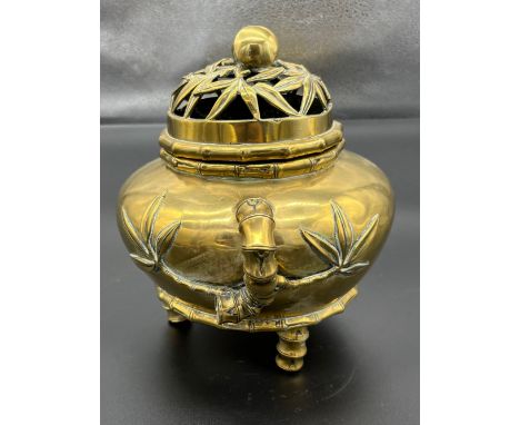 Heavy antique Chinese gilt brass three foot censor burning pot, Detailed with bamboo trunk trims and palms to the main body. 
