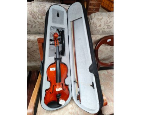 Violin with bow in fitted case . 