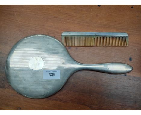 Silver hall marked London comb together with silver hall marked mirror . 
