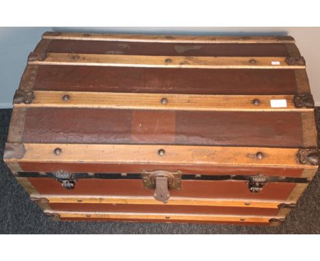 Vintage domed top metal and wood bound travel trunk on castors  [45x75] 