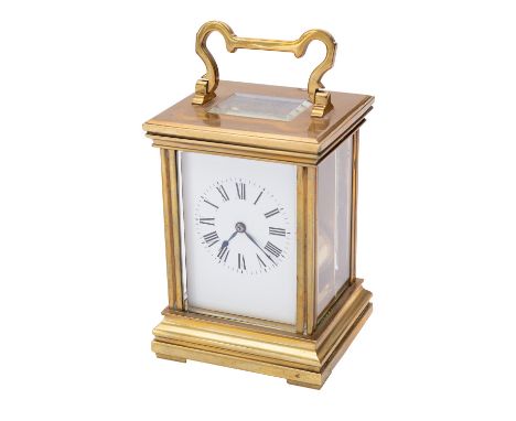 A French Corniche carriage clock having an eight-day duration movement with a platform lever escapement and striking the hour